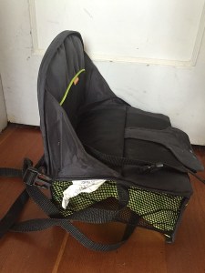 Brica Fold N Go travel booster seat shown from the side