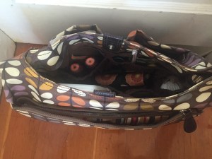 Orla Kiely Baby Changing diaper bag shown open with contents inside