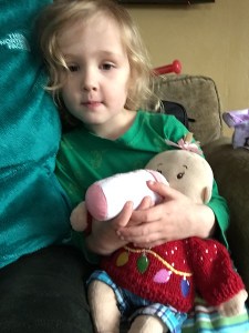 Child bottle feeding Baby Stella doll