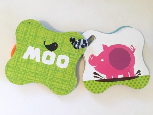 Touch and feel card by Infantino close up on pig textured cards with text shown on facing card