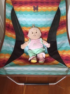 Baby Stella relaxing in Alite designs mayfly chair in southwest pattern