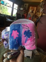 Doodlemals draw on stuffed animal with markers