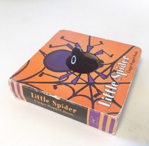 Little Spider finger puppet board book shown from spine