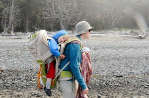 Toddler in Kelty Kids FC 3.0 backpack carrier on the back of a woman and infant in ring sling on front