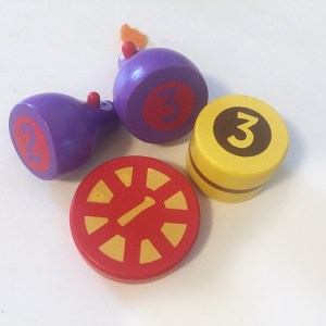 Chicky boom balancing game pieces with numerical values shown