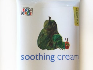 Close up of label with very hungry caterpillar crawling out of a pear on episencial soothing cream