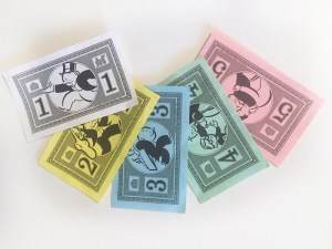 Play money from Monopoly junior property board game for kids in 1 2 3 4 and 5 dollar denominations