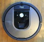 irobot roomba vacuum in silver and black