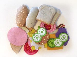 Melissa and Doug felt food set with random assortment of pieces in a pile