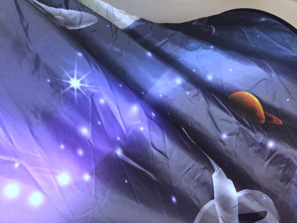 Dream Tent space adventure fabric and pattern with planets and stars on dark background