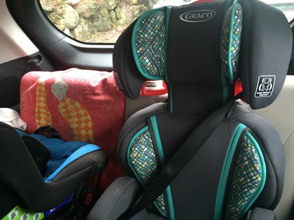 Graco TurboBooster highback booster car seat installed in back row of Mazda5 next to Britax Marathon rear facing