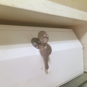 Keys in lock of medicine cabinet safe lockable prescription box