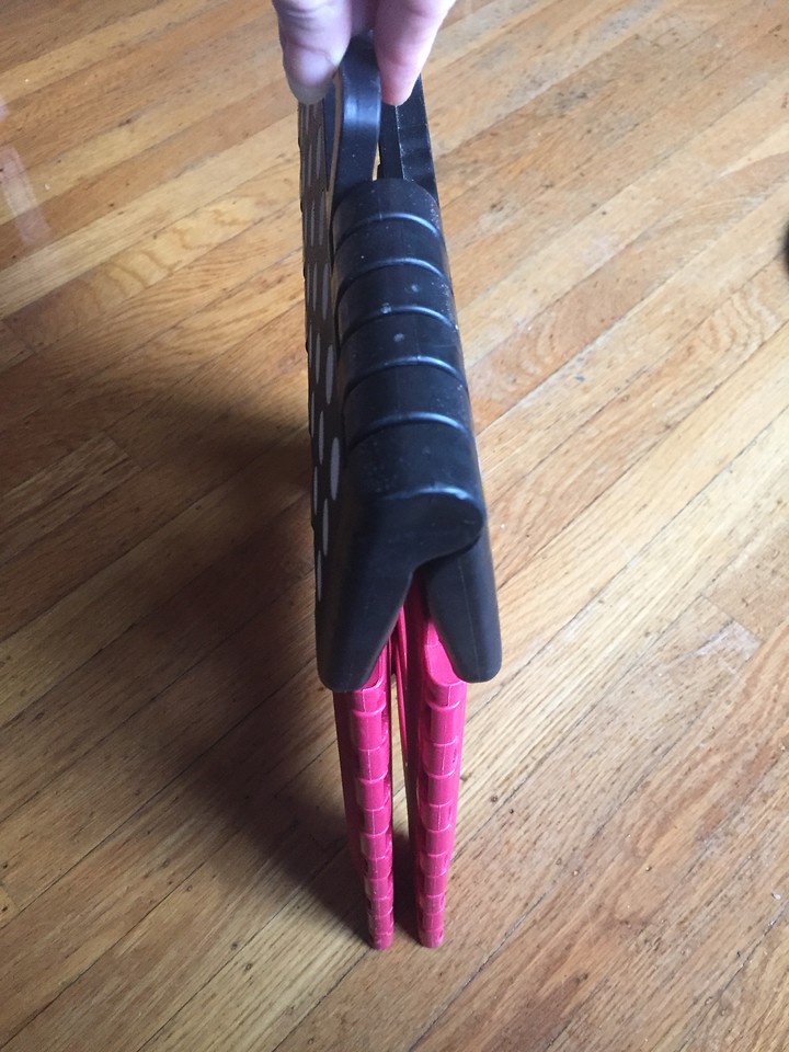 Step Stool folded up as seen from side view no thicker than two fingers