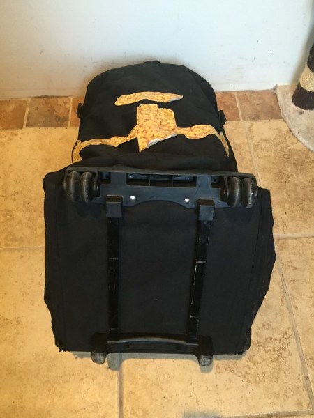Tape on back of car seat travel bag repair