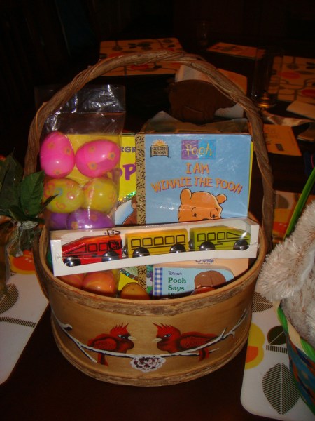 Easter basket for three year old stuffed with IKEA trains, books, and plastic eggs filled with playfoam