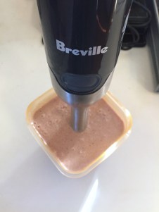 Breville control grip immersion blender mixing chocolate smoothie in container
