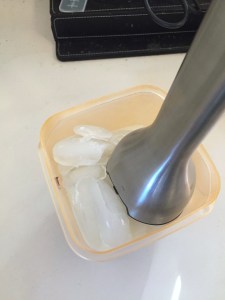 Immersion blender mixing chopping ice