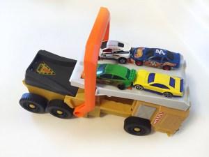 Military truck power launcher with four cars on top by Matchbox