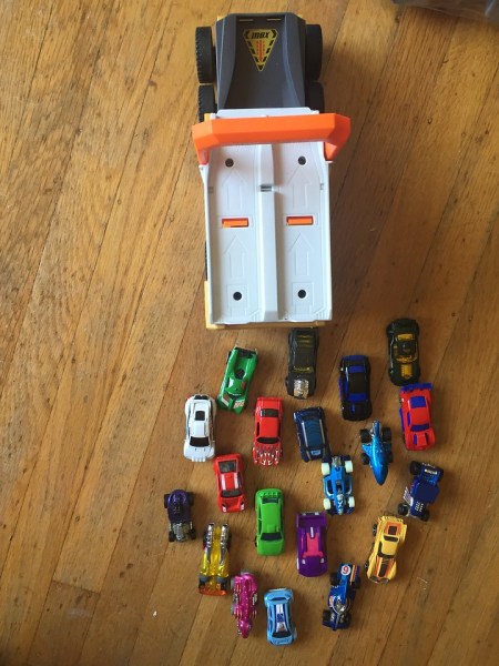 Matchbox power launcher military vehicle with lots of cars behind it