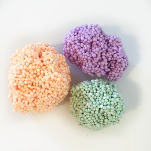 Playfoam molding substance in orange, purple, and green