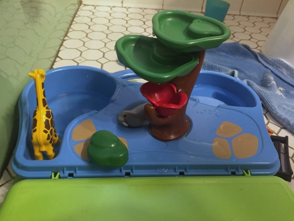 Playmobil take along zoo set up in bathroom by child