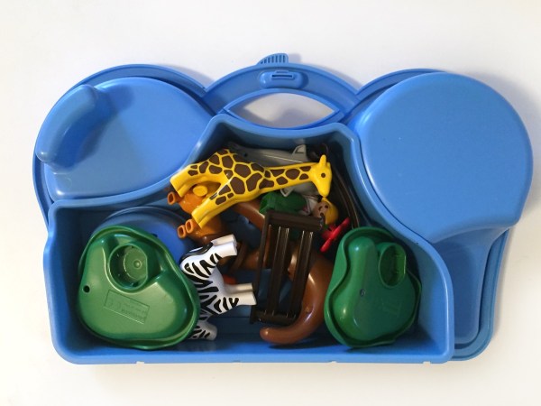 Playmobil take along zoo play set with pieces packed into blue side of carrying case