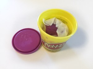 Play dough in container wrapped in moist paper towel