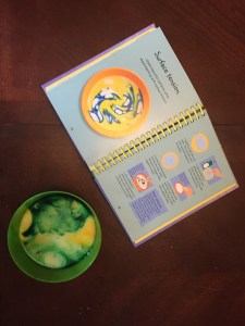 Surface tension project with water milk pepper and food coloring