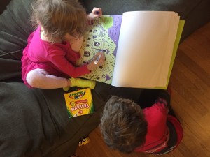 Kids connecting the dots on the big dot to dot pad