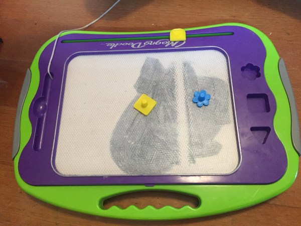 Magna board with white stripe in middle of coloring surface