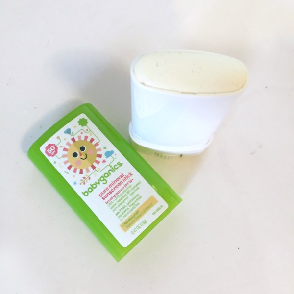Open container of Babyganics sunscreen stick pure mineral formula SPF 50 green lid