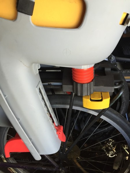 Topeak baby bike seat attached over rear wheel of bicycle