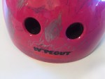 Close up of hot pink wipeout helmet decorated with dry erase markers