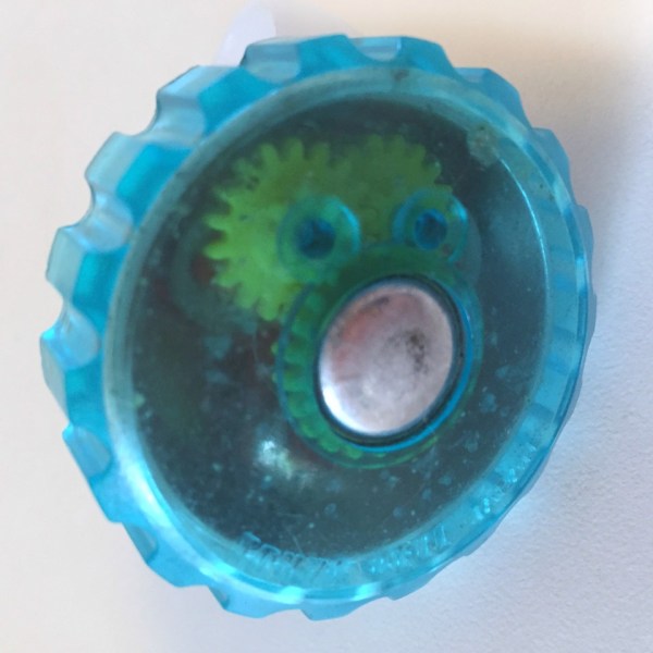 Close up of gears seen through translucent blue bell cover