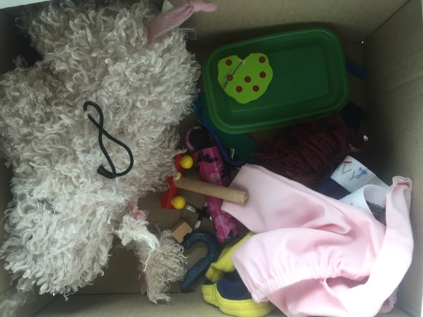 Miscellaneous broken toys and clothing awaiting repair