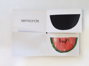 Page spread of watermelon and semicircle match from My Very First Book of Shapes by Eric Carle