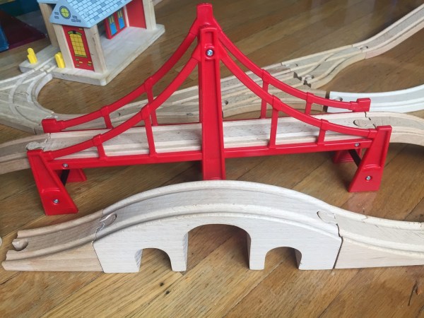 Suspension bridge behind arched bridge