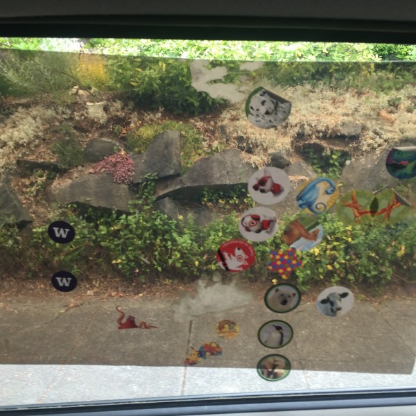 Car window cling shade with stickers stuck to it