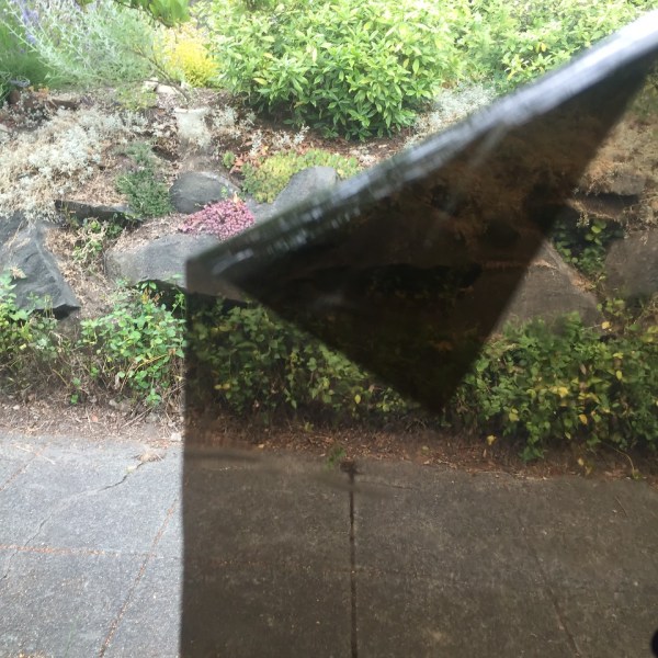 Car window cling shade with one corner pulled down