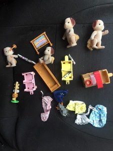 Calico Critters Choo Choo set with four dogs spread out on seat of car