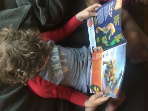 Child reading Highlights magazine