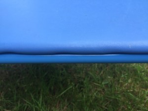 Close of of side of kids blue folding table