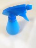 Empty blue water spray bottle