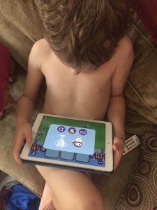 Child playing Gus on the Go app on ipad