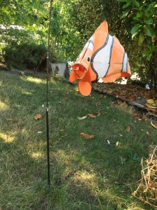 Clownfish windsock swimming in air yard decor on pole
