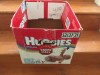 Huggies Size 1-2 empty diaper box sitting on stairs