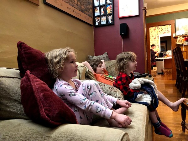 Kids on sofa watching movie