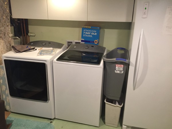 Kenmore giant sized high capacity washer dryer installed in basement laundry area