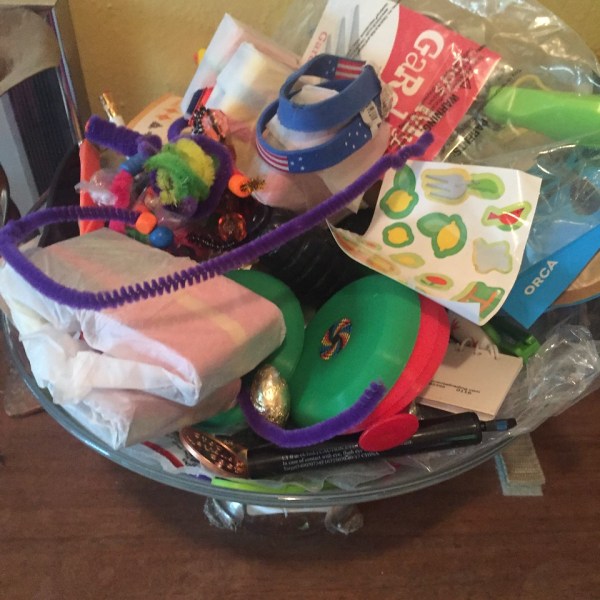 Bowl filled with random toys and kid items