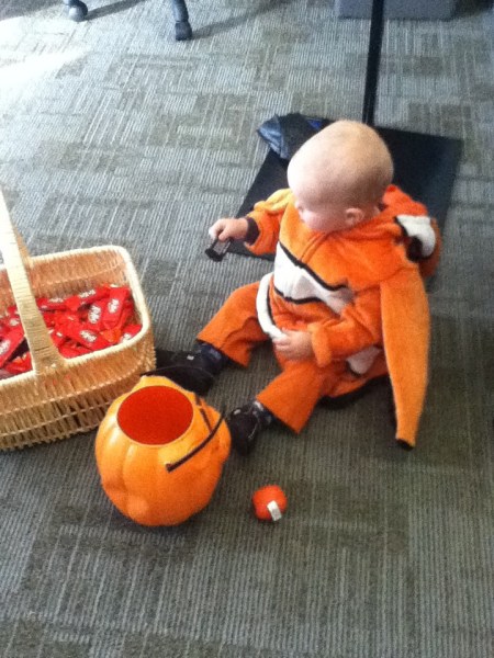 Toddler wearing oversized Nemo clownfish costume
